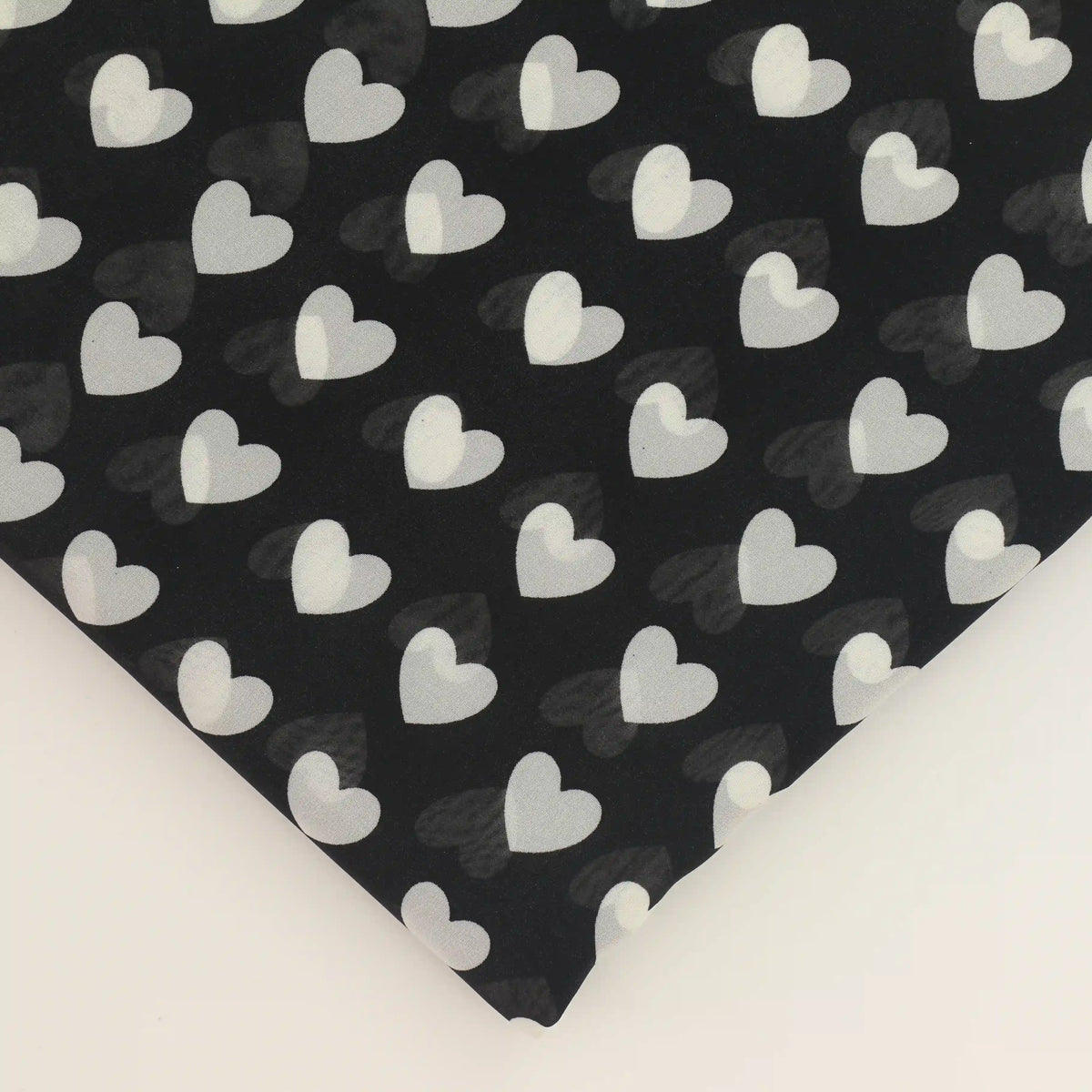 black-and-white-heart-print-chiffon-fabric – close-up of colour, pattern and texture