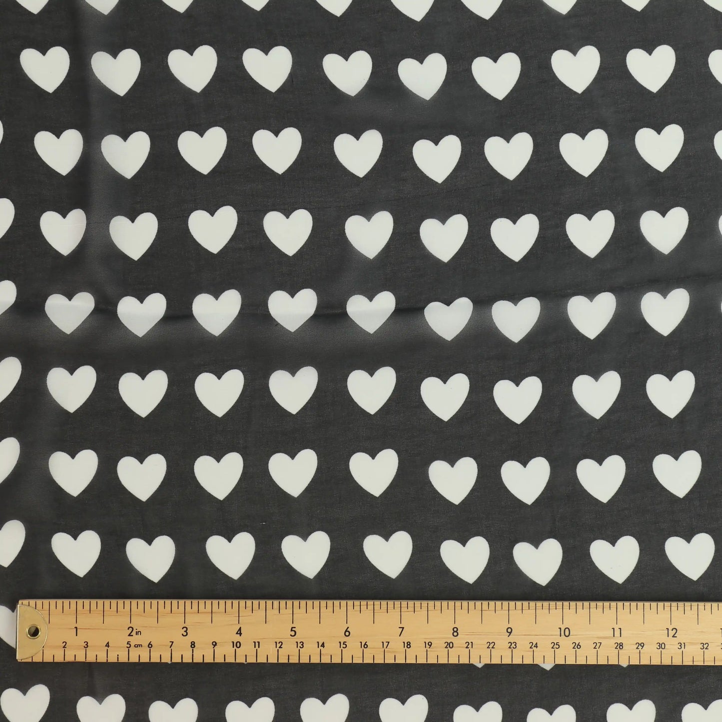 black-and-white-heart-print-chiffon-fabric – close-up showing weave and surface detail