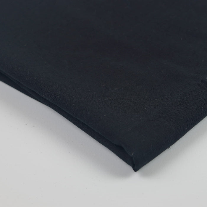 Black linen effect viscose fabric folded showing detail