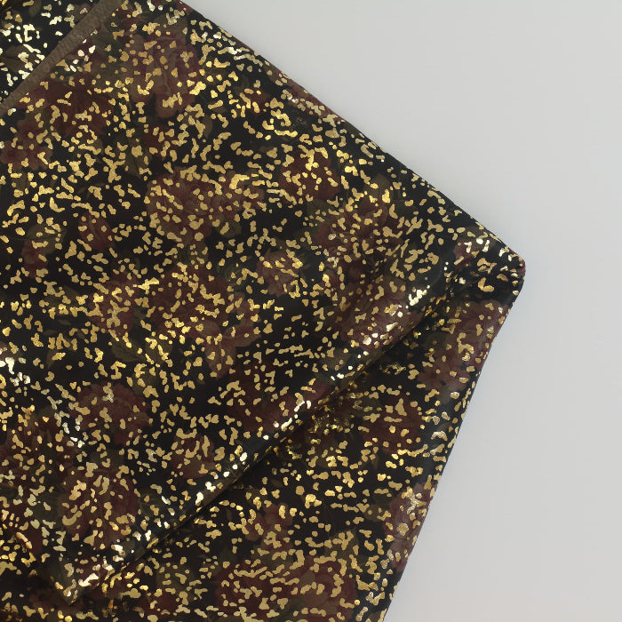 Black & Gold Metallic Jersey Fabric folded showing detail