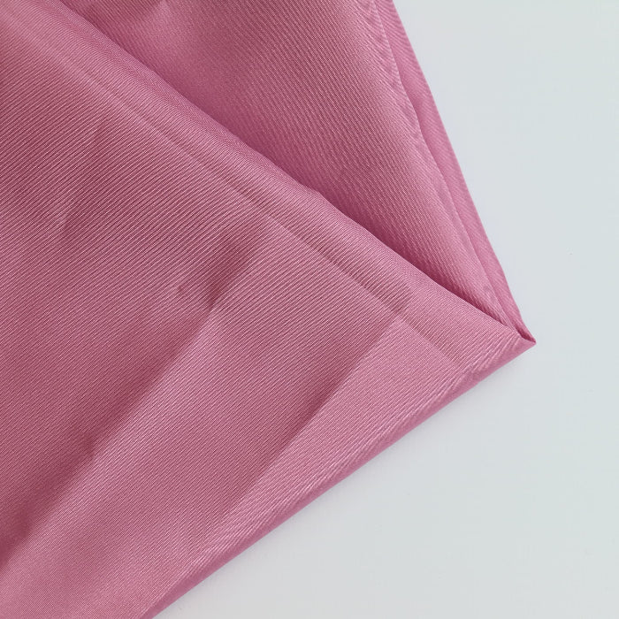 Pink Polyester Lining Fabric folded showing detail
