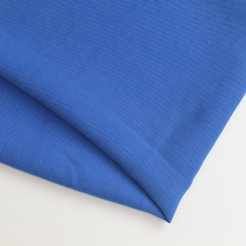 Royal blue viscose twill fabric remnant folded showing detail