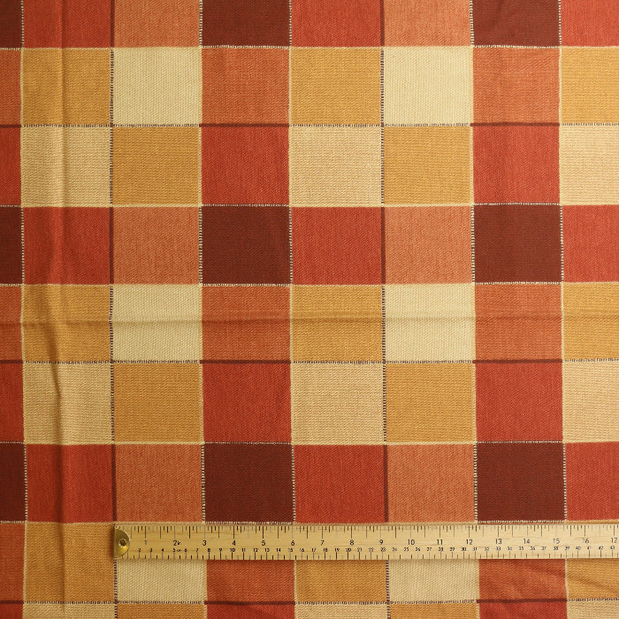 Red orange & gold checked cotton home decor fabric laid flat