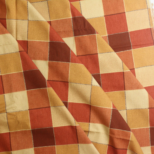 Red orange & gold checked cotton home decor fabric folded