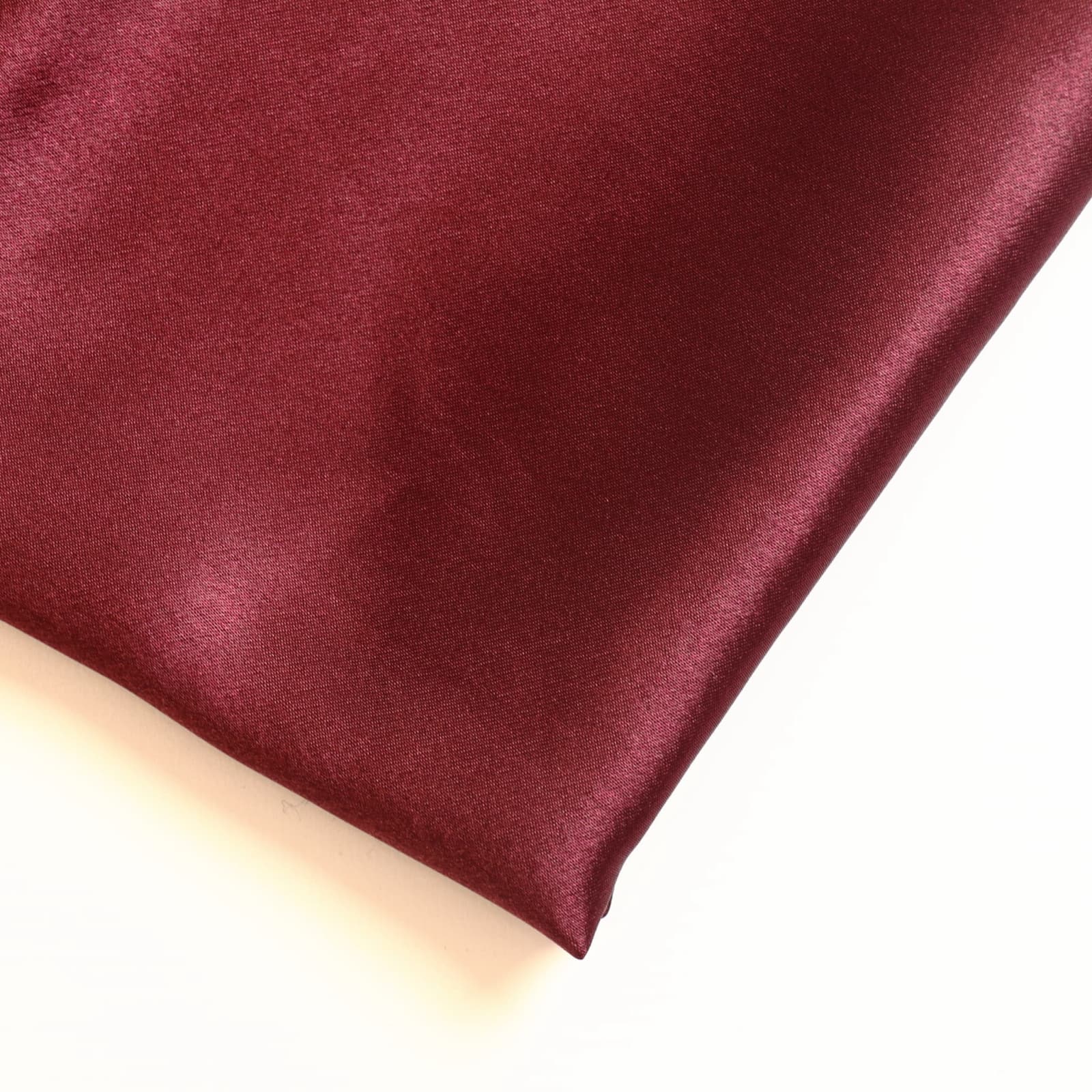 Wine red polyester satin fabric close up