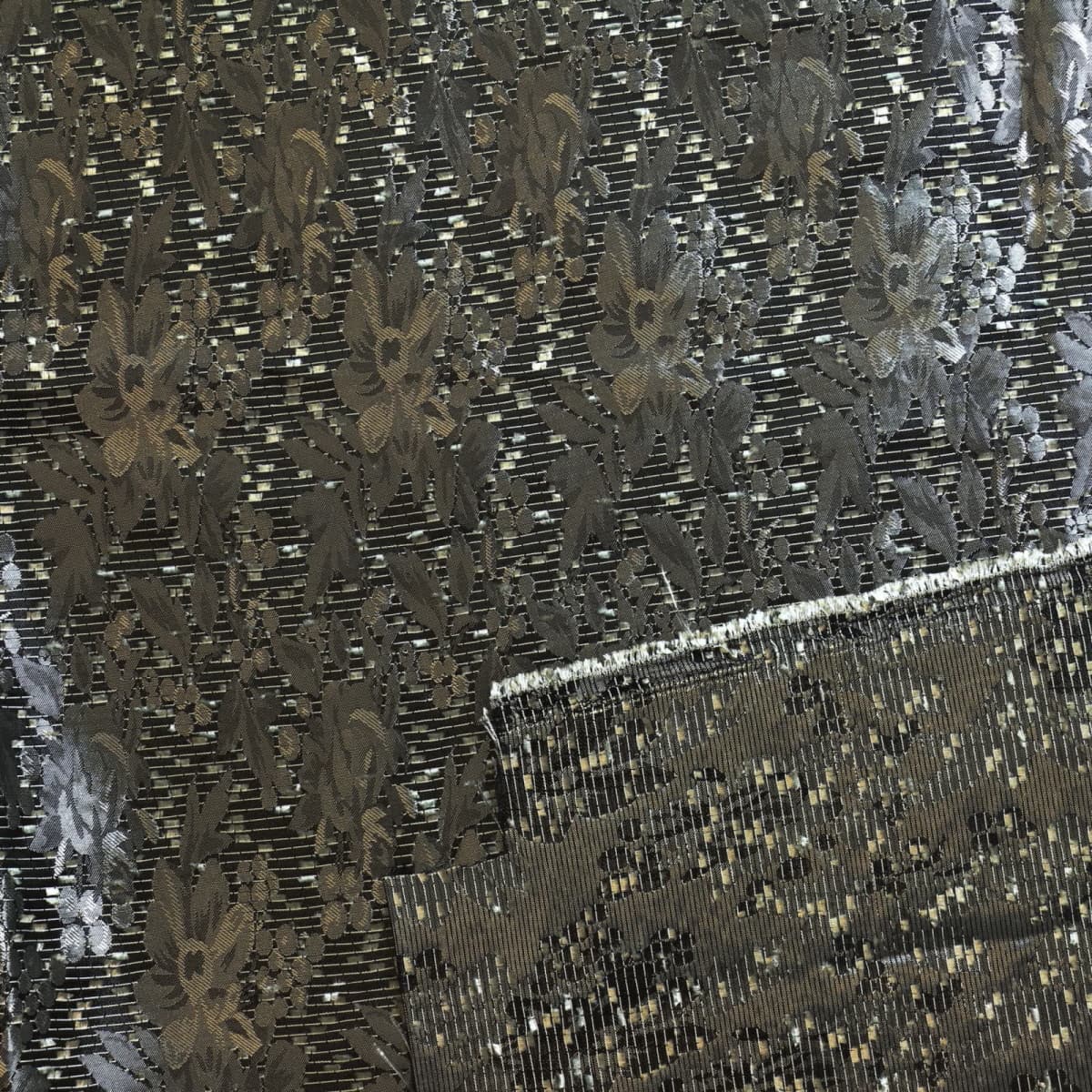 Silver & Black Jacquard fabric laid flat and showing reverse