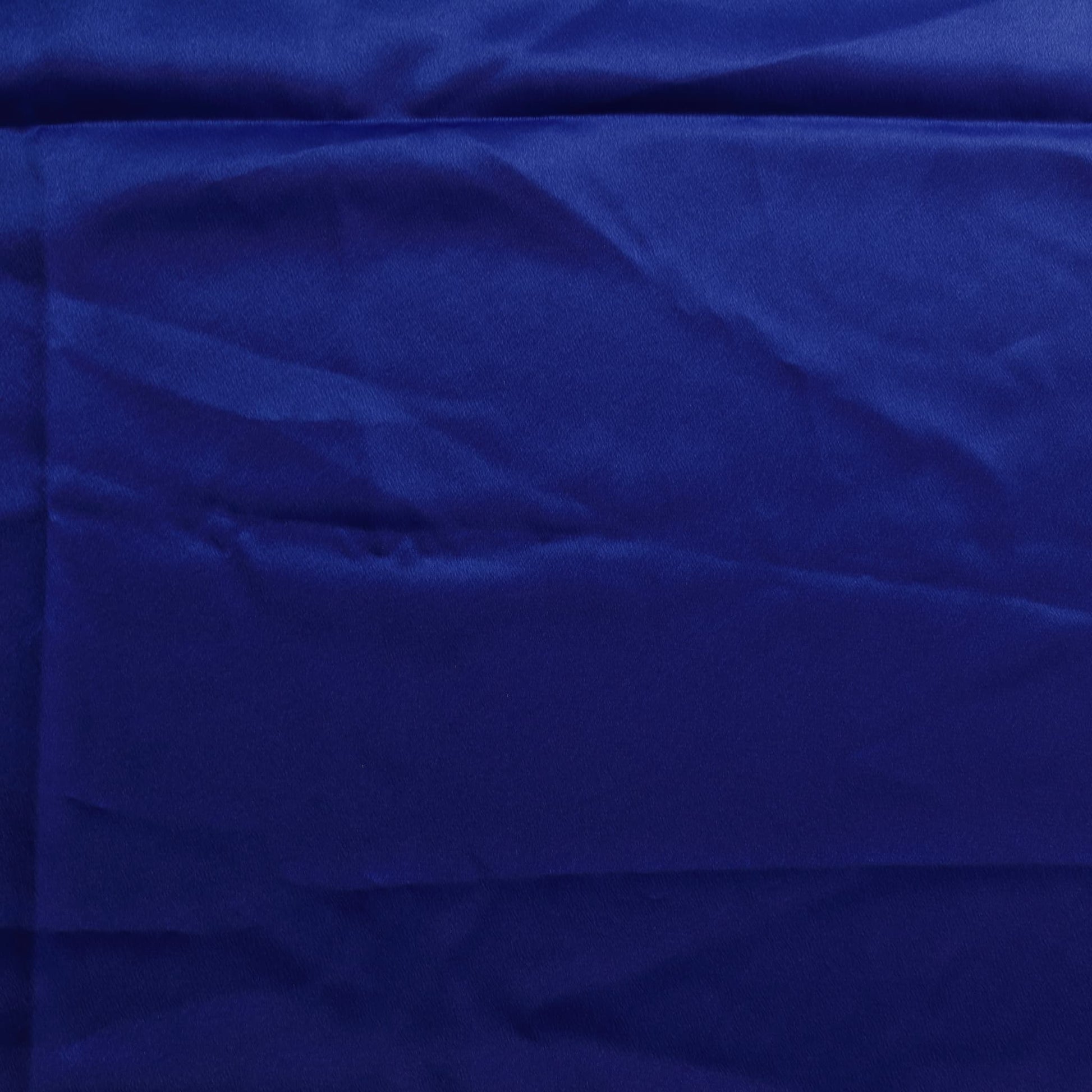 Bright blue polyester satin fabric laid flat
