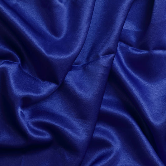 Bright blue polyester satin fabric showing drape