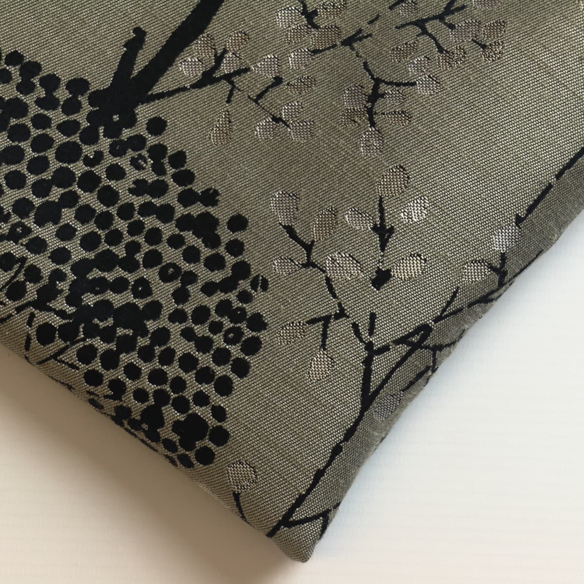Beige & black tree print jacquard fabric close up