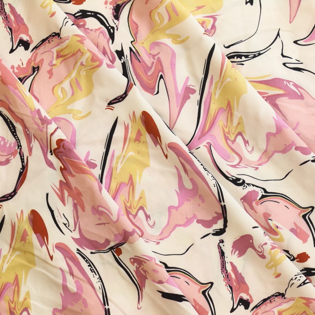 Off-white pink & black graphic print fabric gently folded