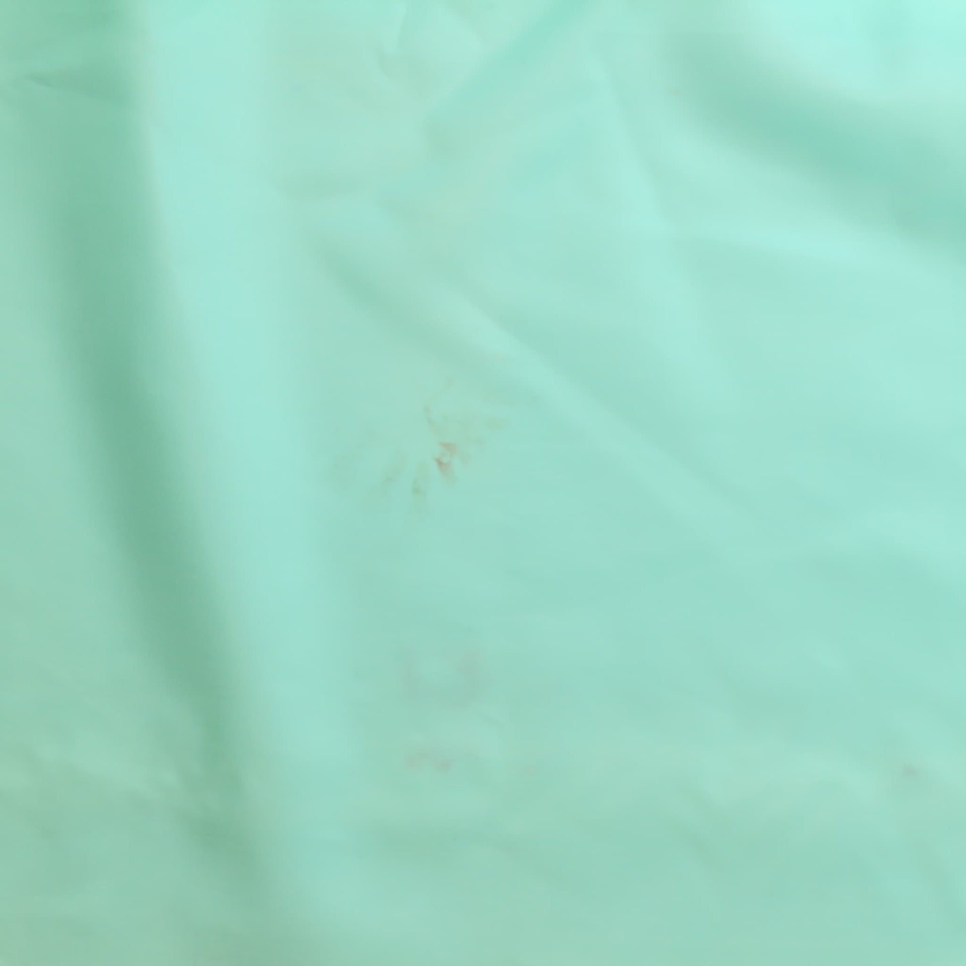 Turquoise nylon satin fabric reverse showing mark 