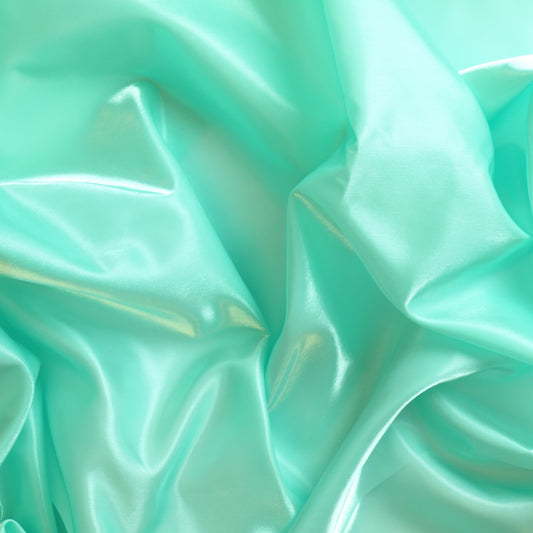 Turquoise nylon satin fabric showing drape