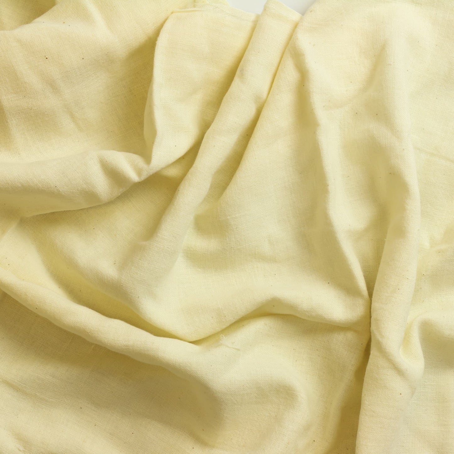 Cream butter muslin sewing fabric showing drape