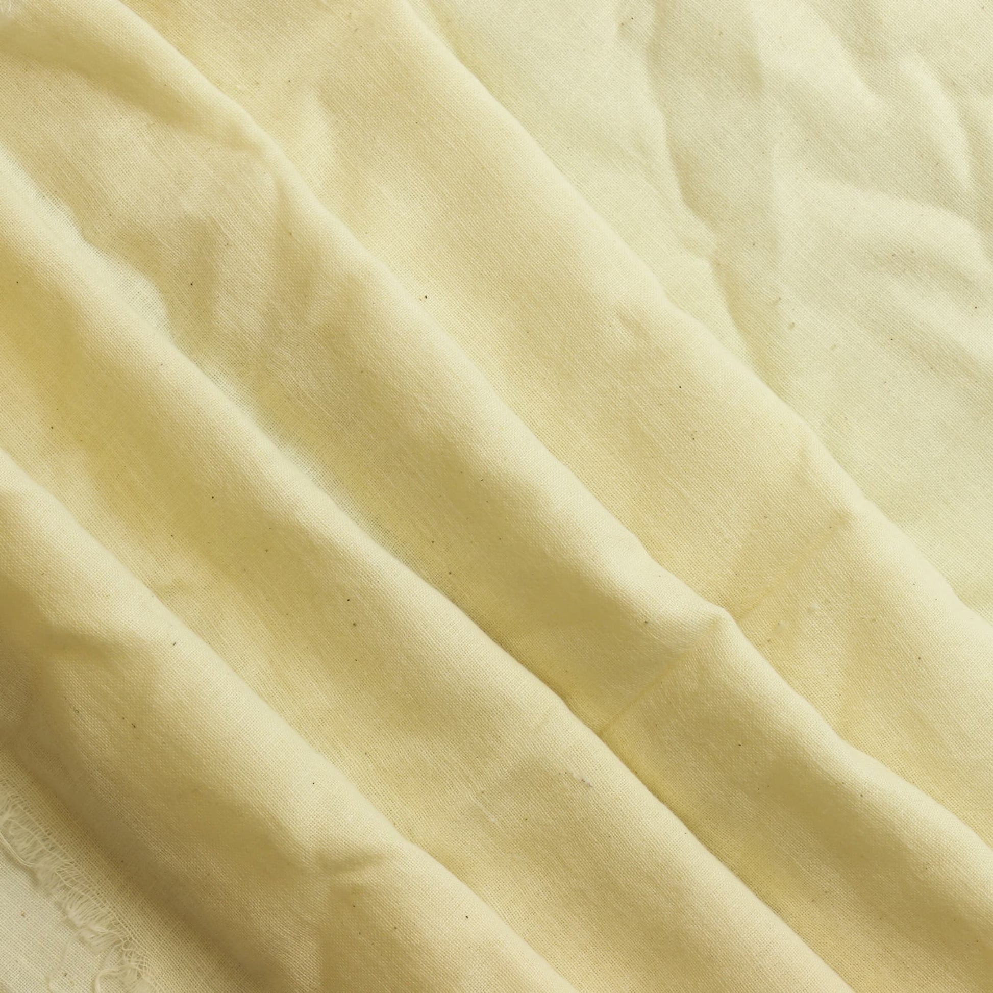 Pale blue cotton blend dressmaking fabric softly folded