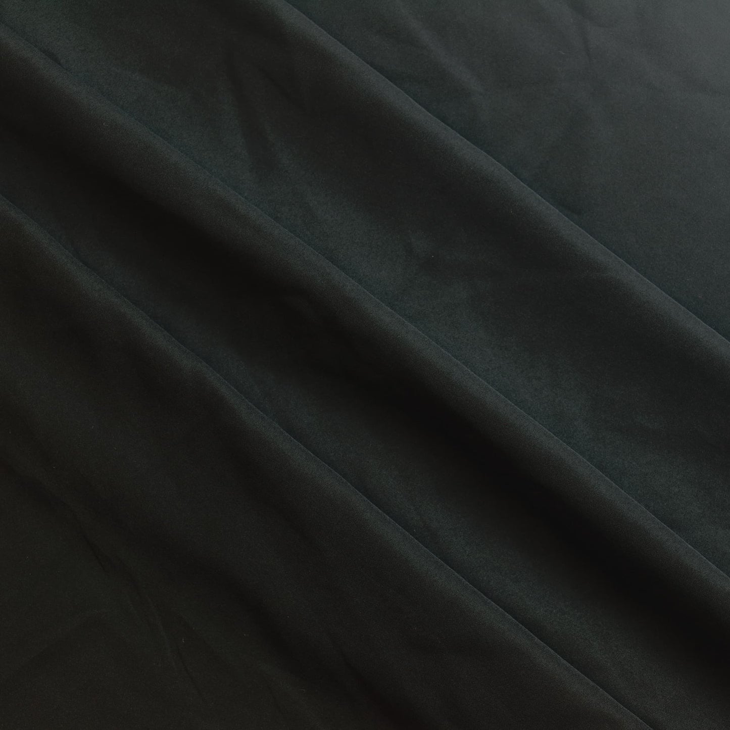 Black polyester sewing fabric gently folded
