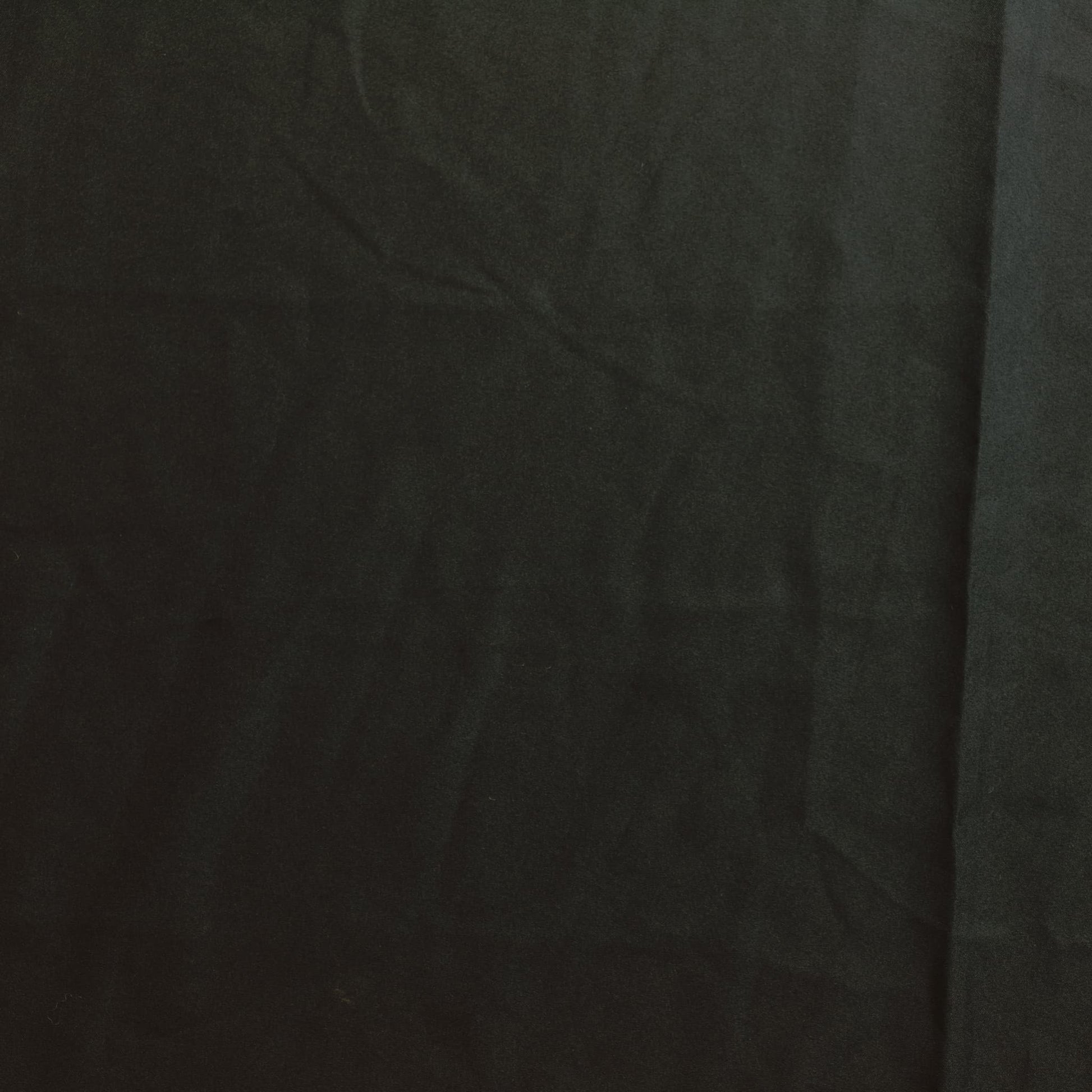 Black polyester sewing fabric laid flat