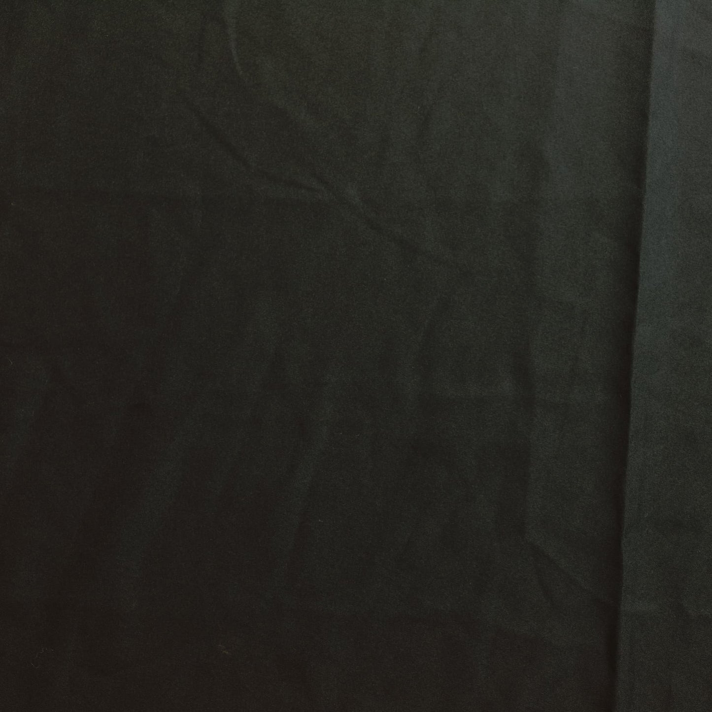 Black polyester sewing fabric laid flat
