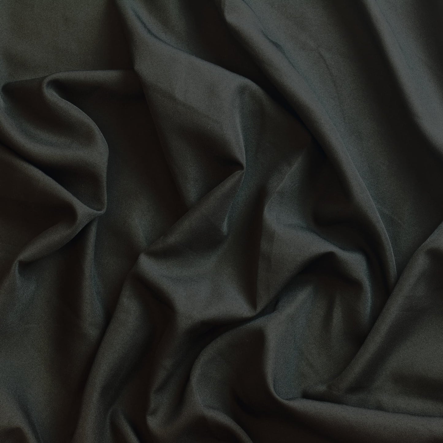Black polyester sewing fabric showing drape