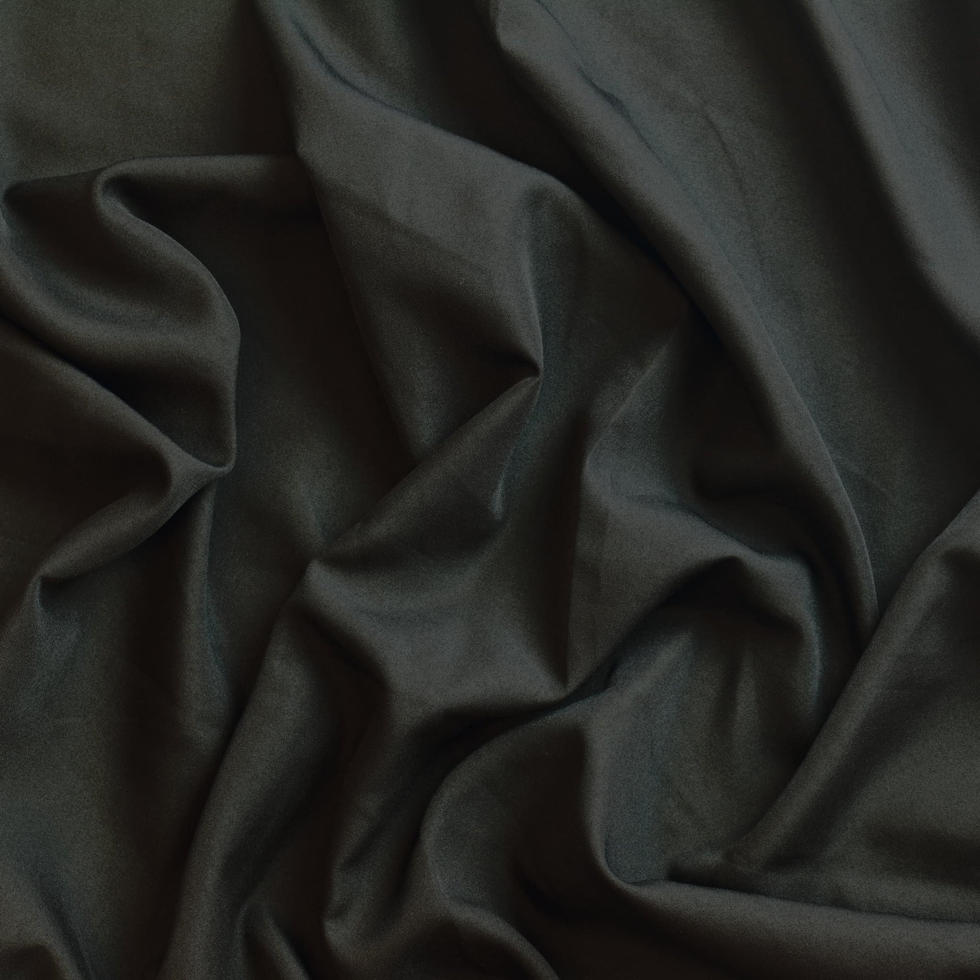 Black polyester sewing fabric showing drape