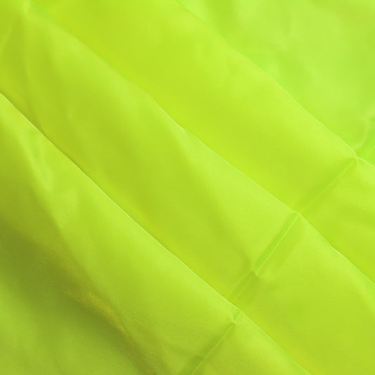 Fluoro yellow nylon taffeta sewing fabric softly folded
