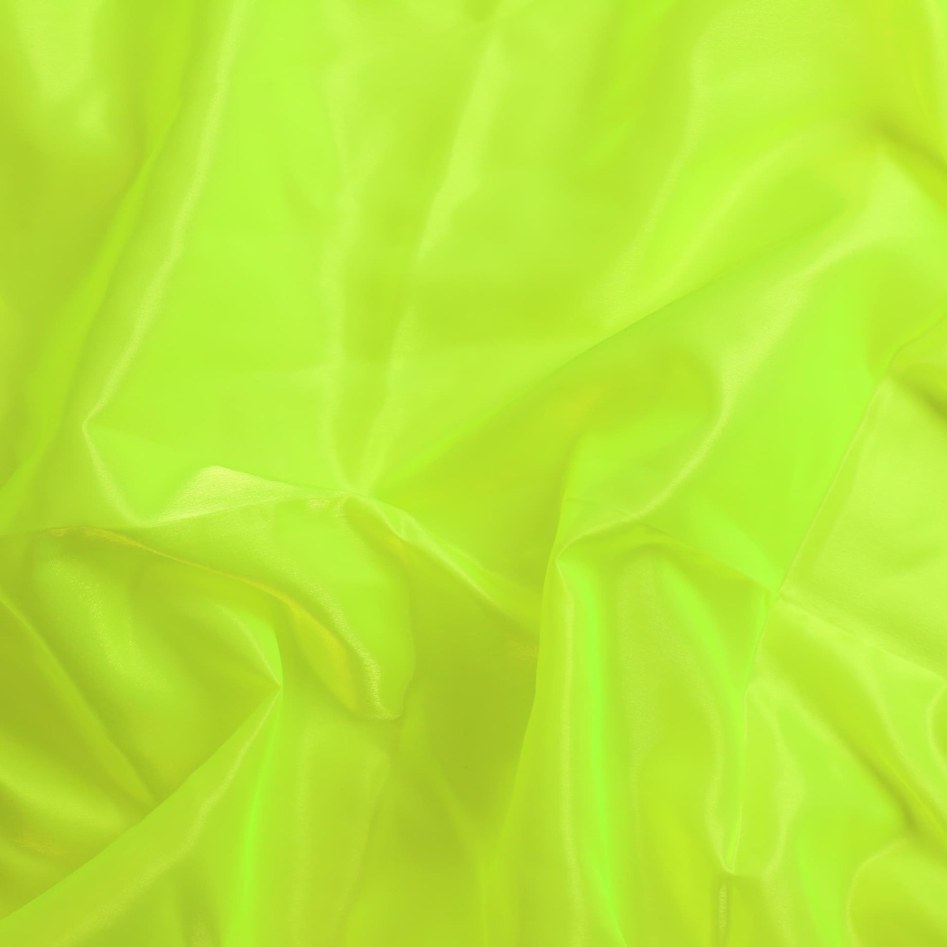 Fluoro yellow nylon taffeta sewing fabric showing drape