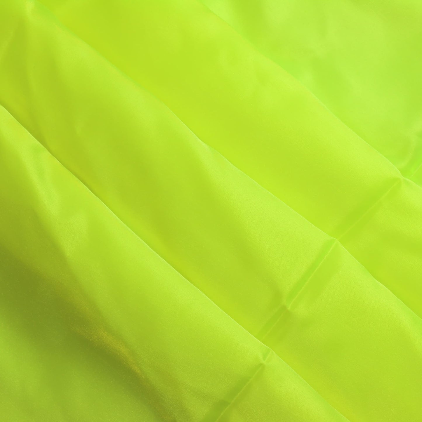 Fluoro yellow nylon taffeta sewing fabric softly folded