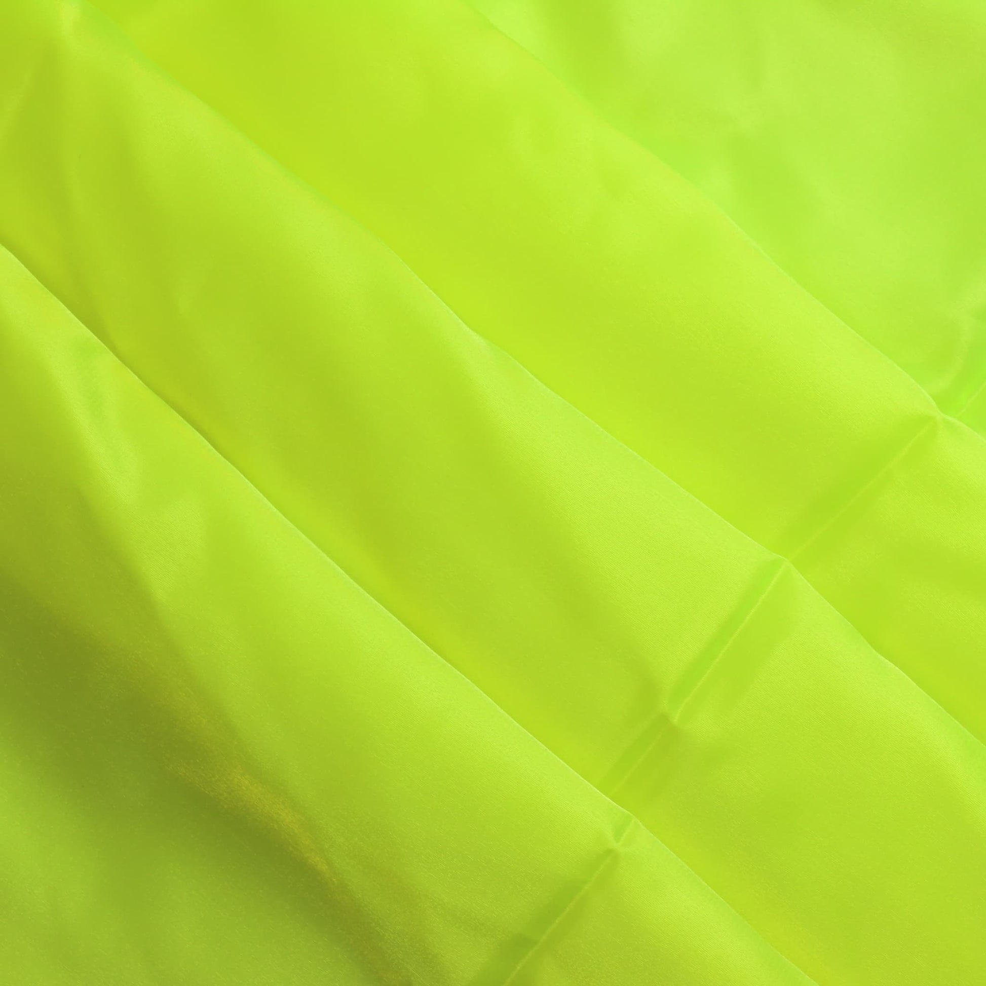 Fluoro yellow nylon taffeta sewing fabric softly folded