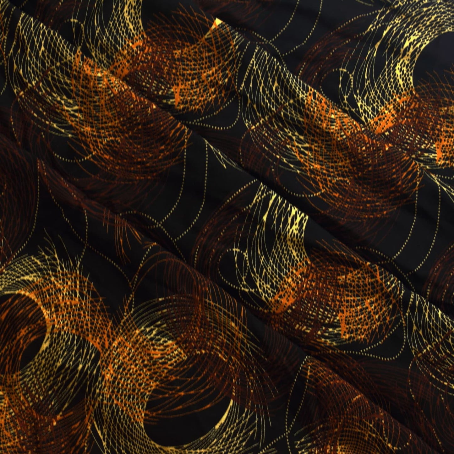 Black & gold graphic print viscose twill sewing fabric sofly folded