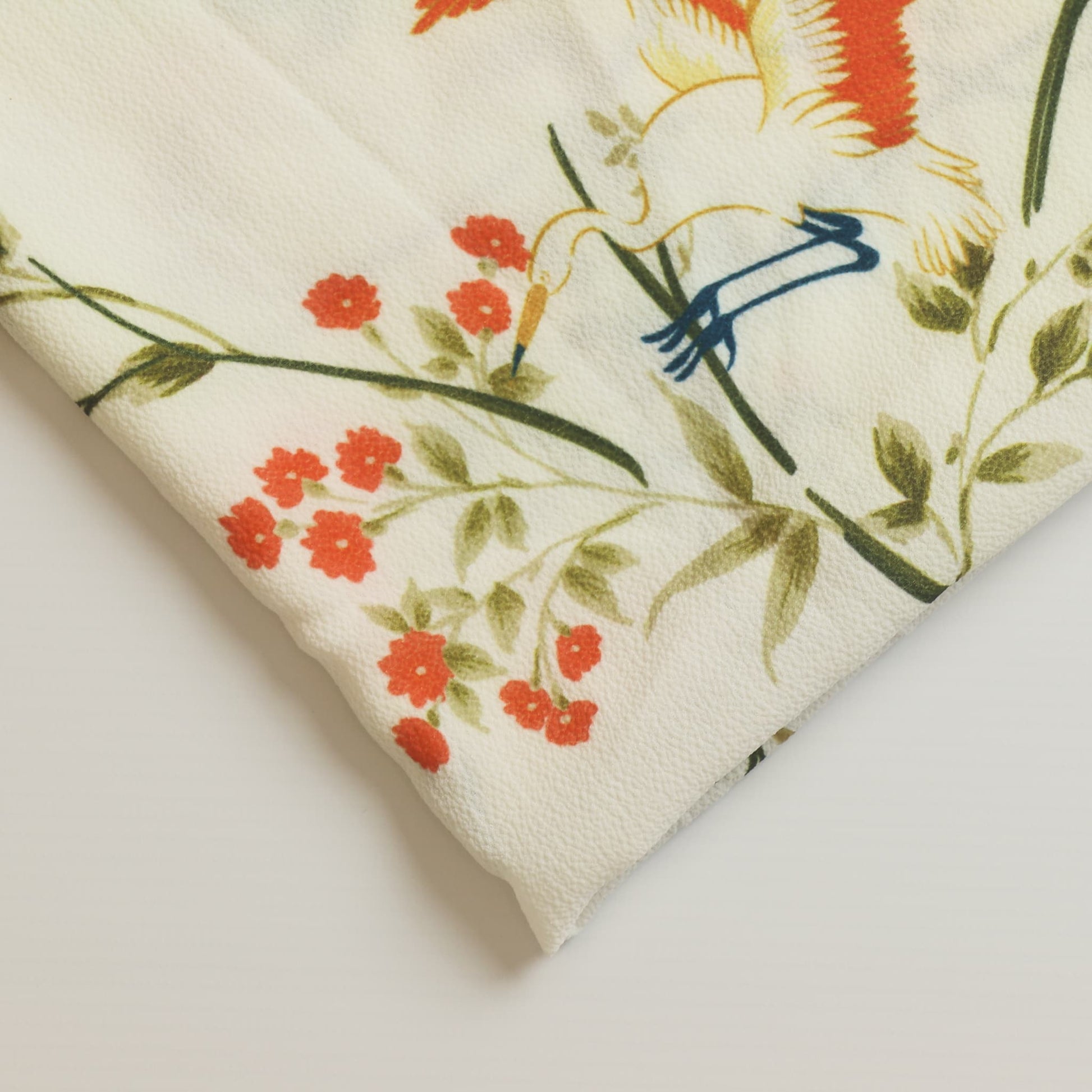 White floral crane print polyester sewing fabric close up