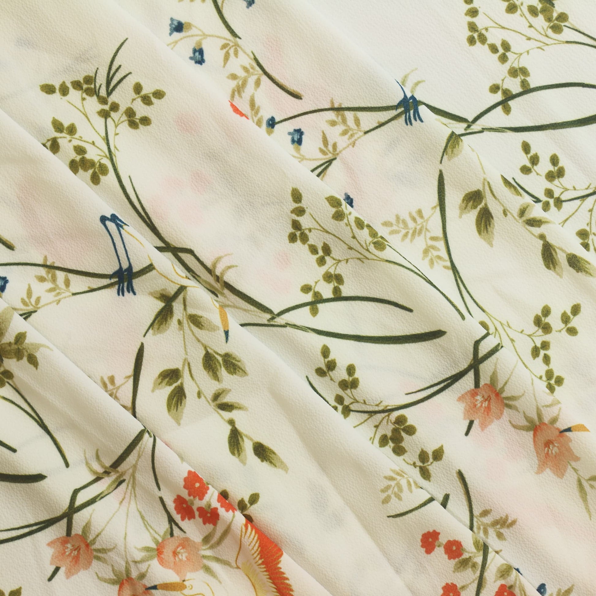 White floral crane print polyester sewing fabric gently folded