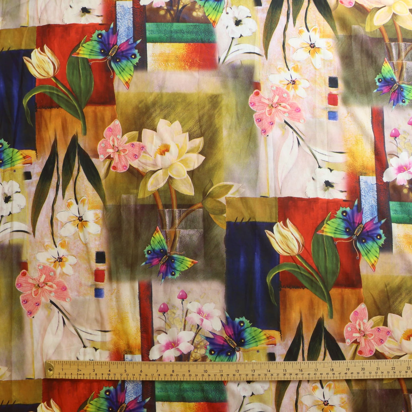 Floral graphic print polyester sewing fabric laid flat