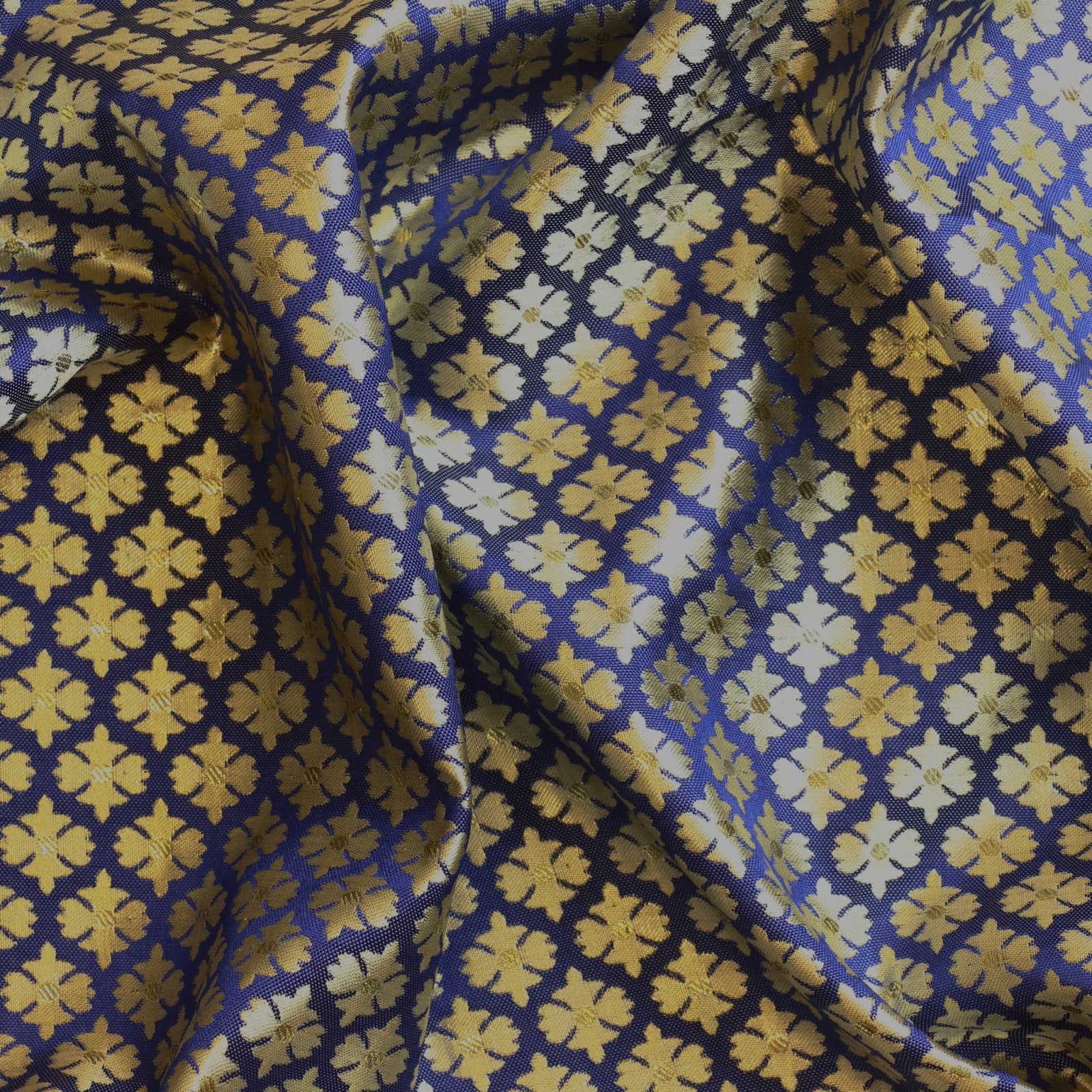 Blue & gold floral jacquard sewing fabric showing drape