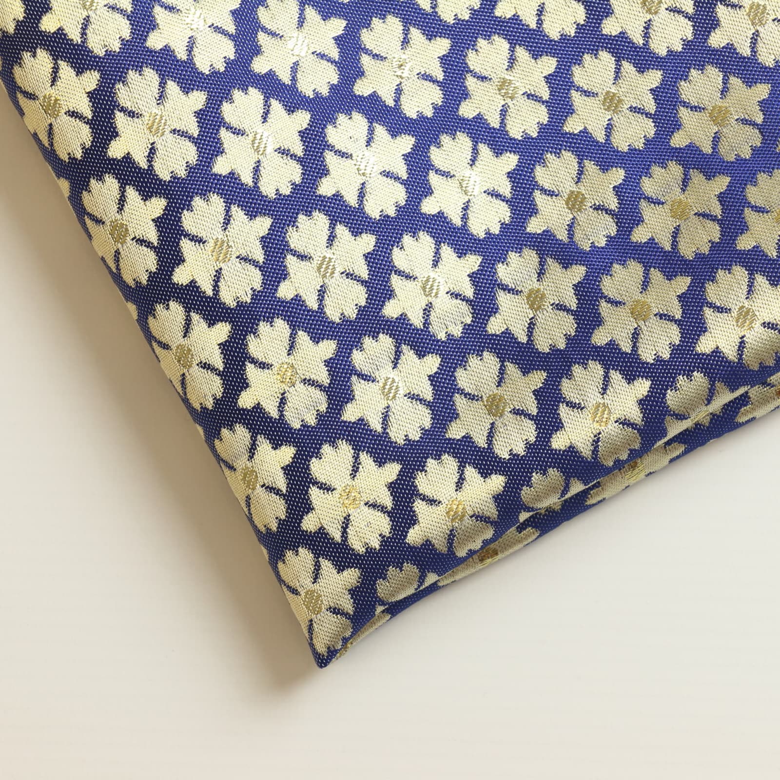 Blue & gold floral jacquard sewing fabric close up