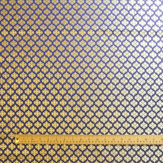 Blue & gold floral jacquard sewing fabric laid flat with ruler for scale