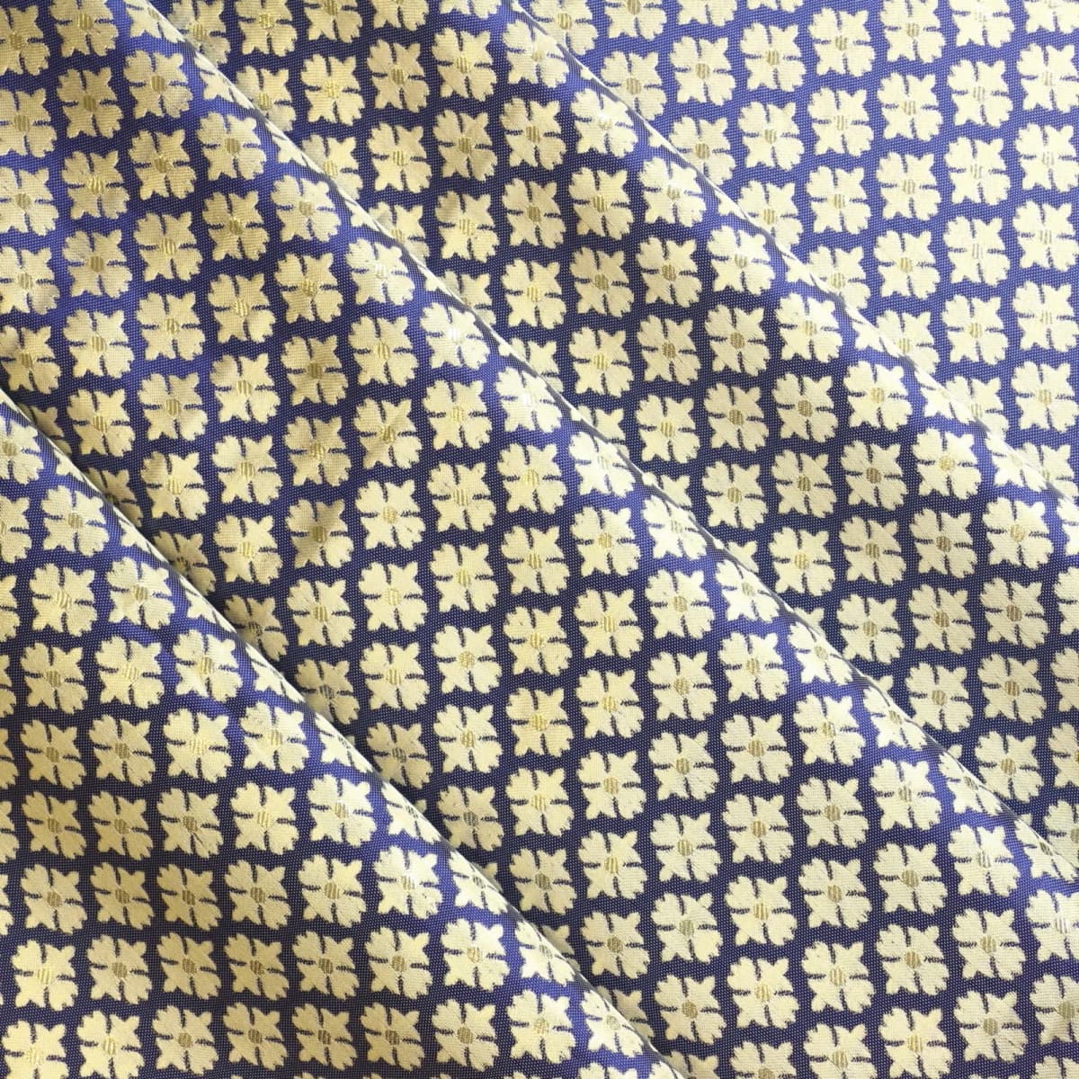 Blue & gold floral jacquard sewing fabric softly folded
