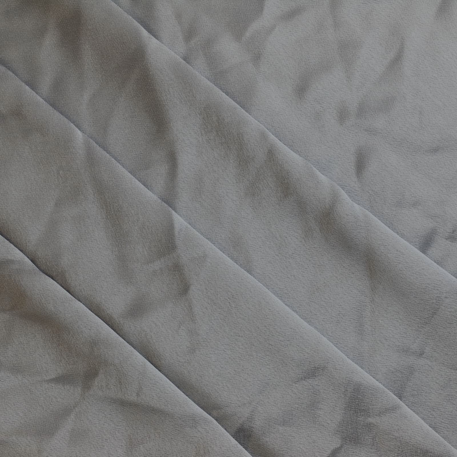 Steel gray polyester satin sewing fabric gently folded