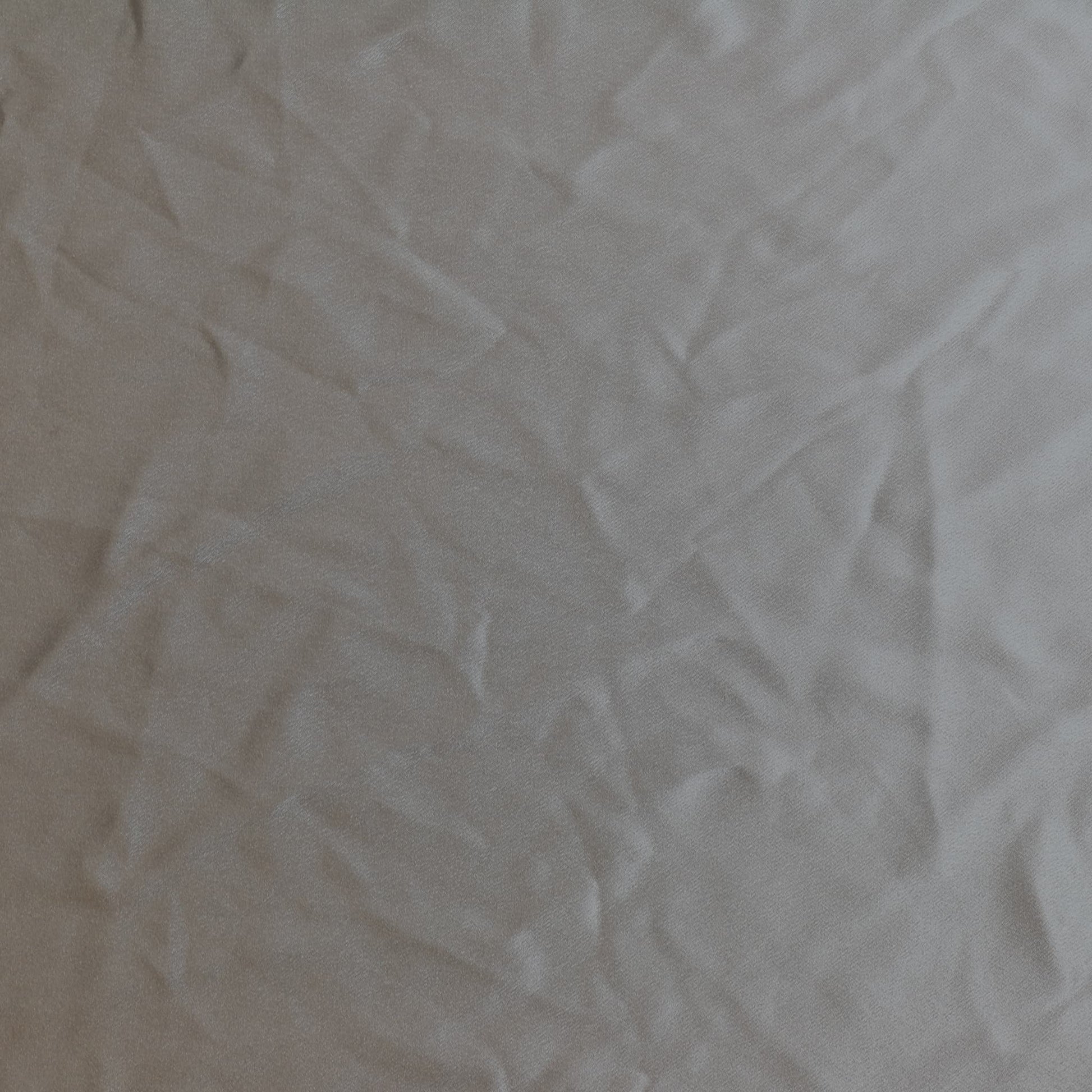 Steel gray polyester satin sewing fabric laid flat