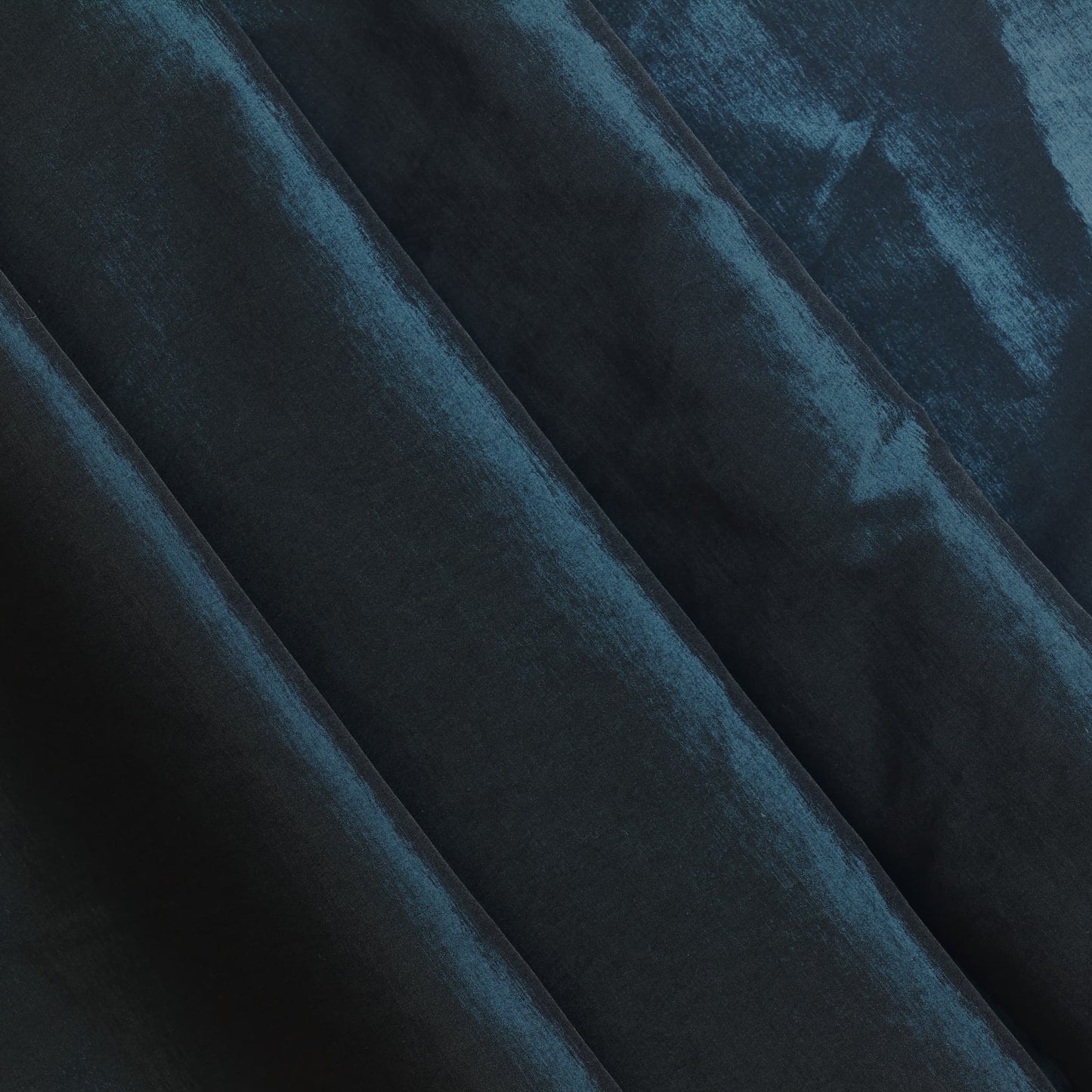 Dark teal stretch dupioni sewing fabric softly folded