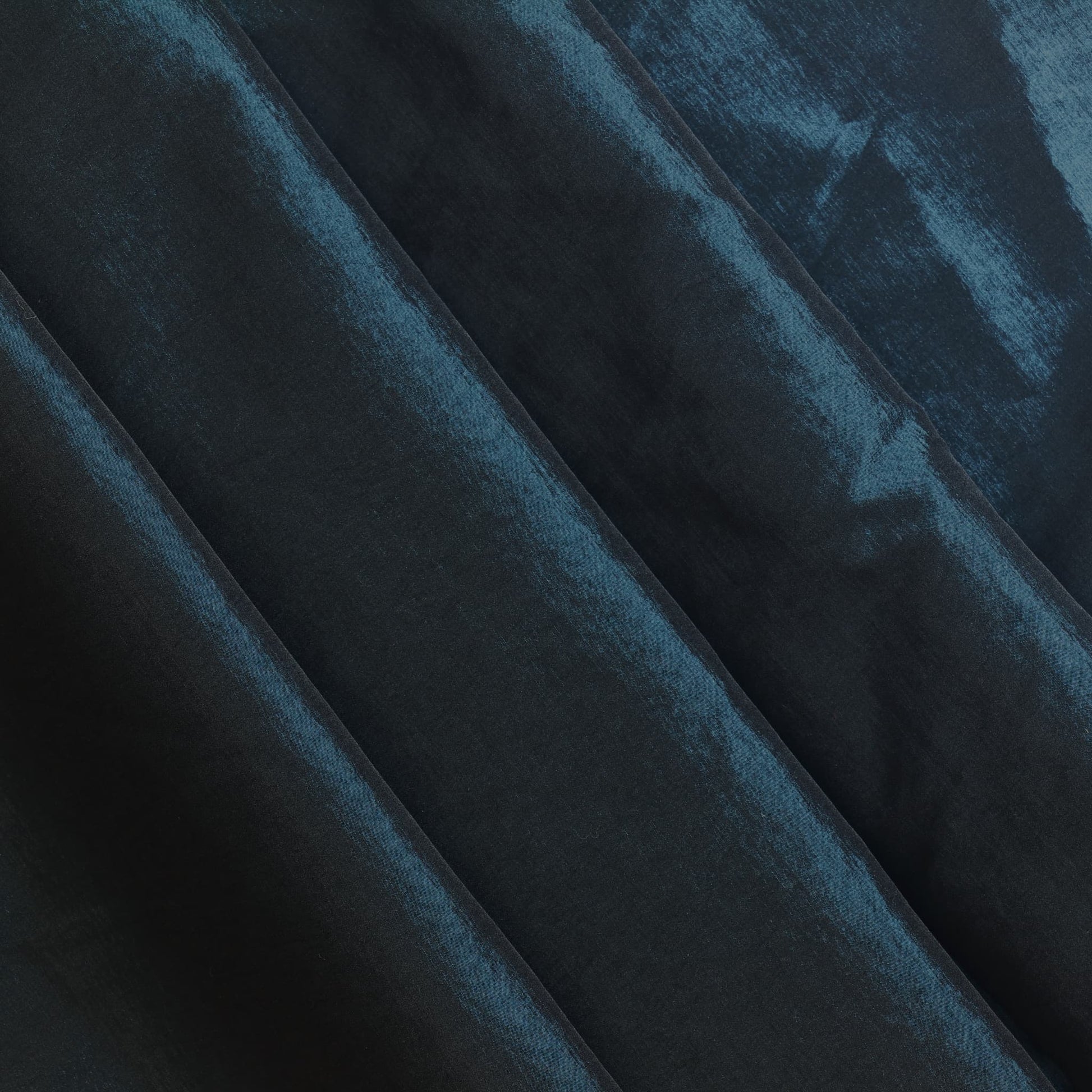 Dark teal stretch dupioni sewing fabric softly folded