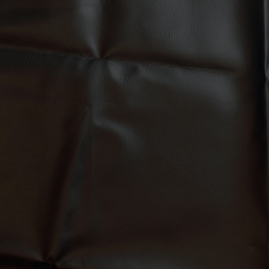 Black PU faux leather sewing fabric laid flat