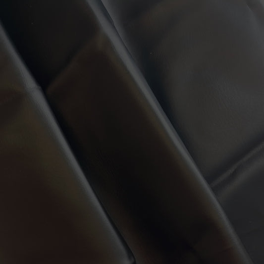 Black PU faux leather sewing fabric gently folded