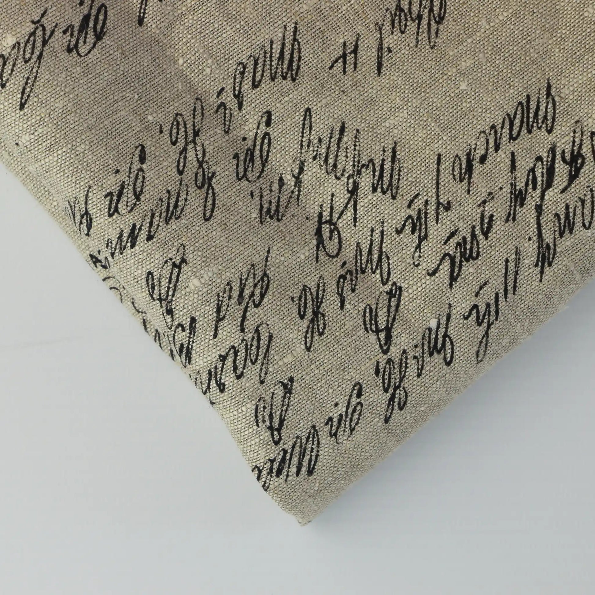 beige-script-print-linen-effect-home-decor-fabic-remnants – close-up of colour, pattern and texture
