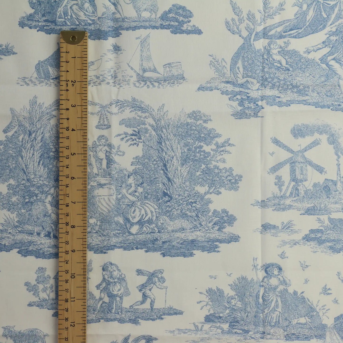 blue-&-cream-toile-de-jouy-cotton-fabric- – close-up of colour, pattern and texture