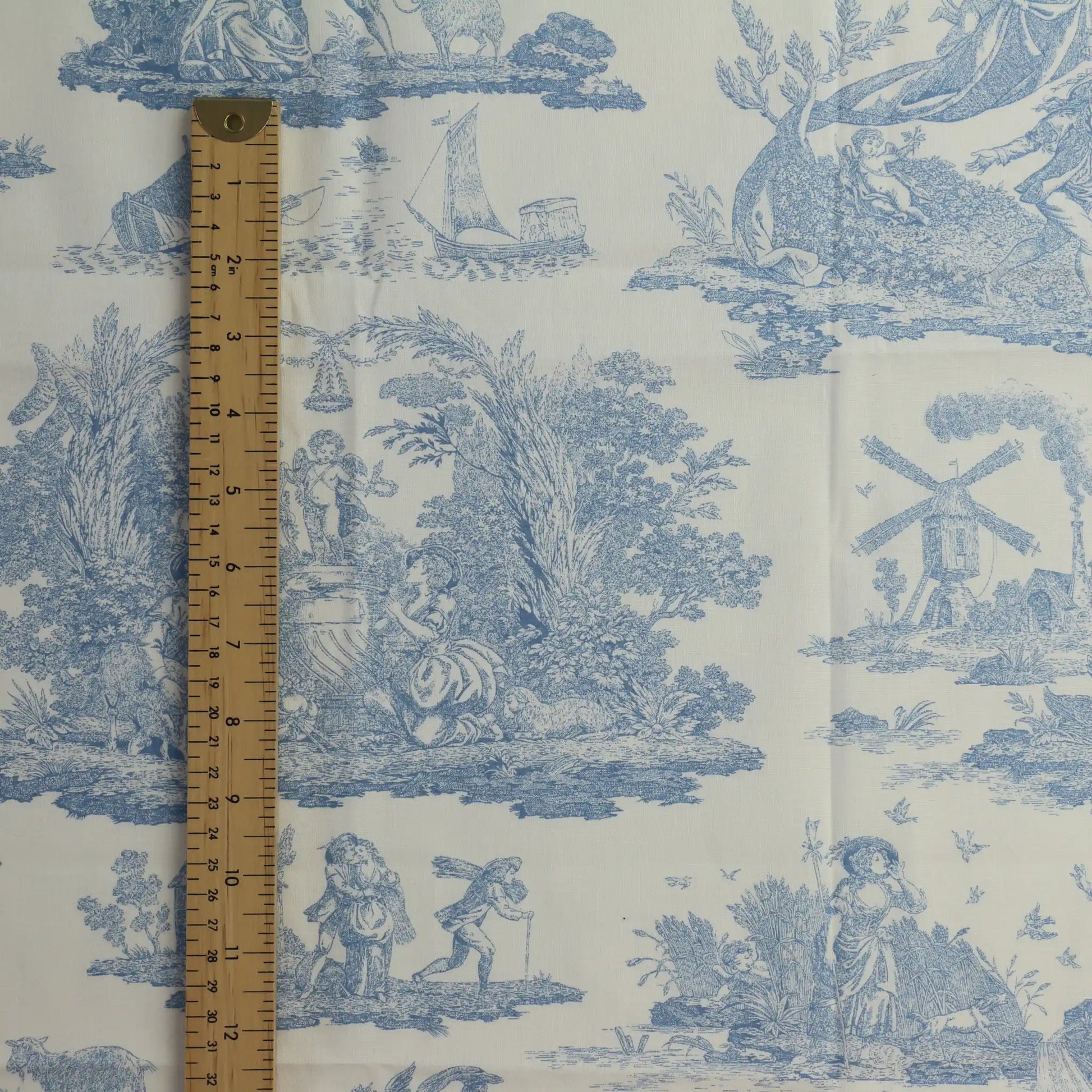 blue-&-cream-toile-de-jouy-cotton-fabric- – close-up of colour, pattern and texture