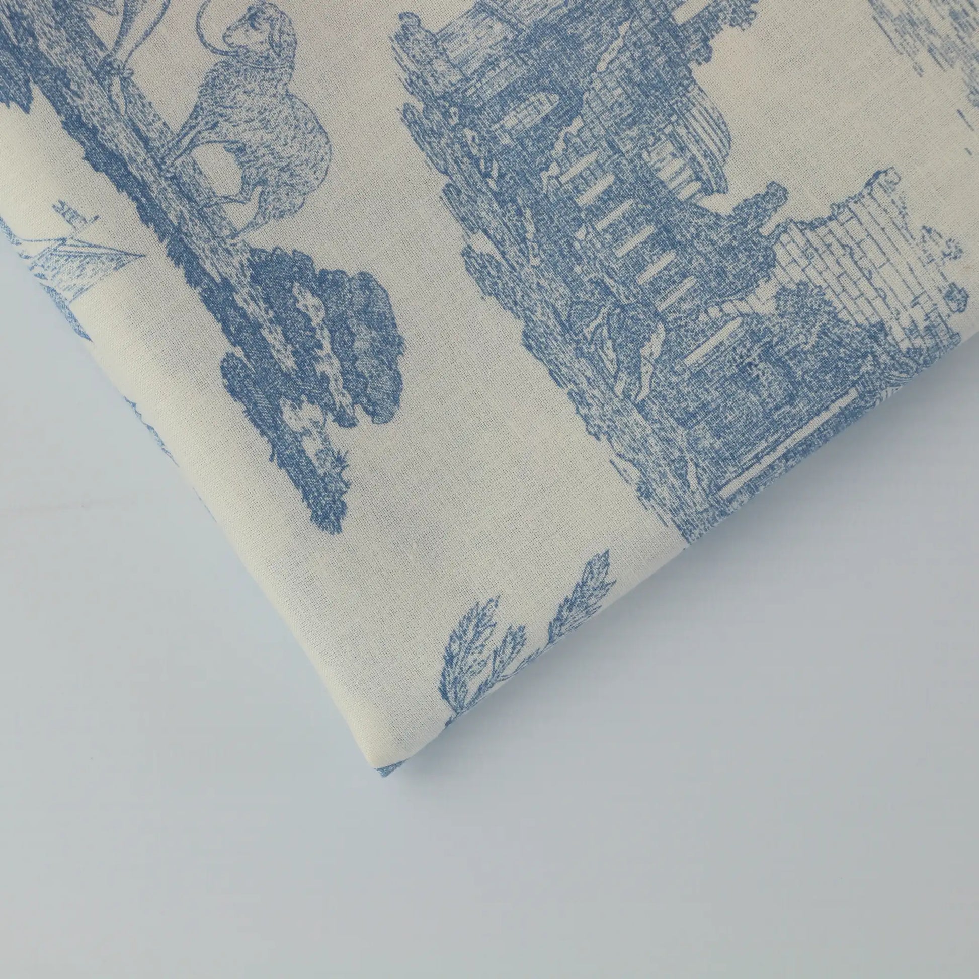 blue-&-cream-toile-de-jouy-cotton-fabric- – close-up showing weave and surface detail