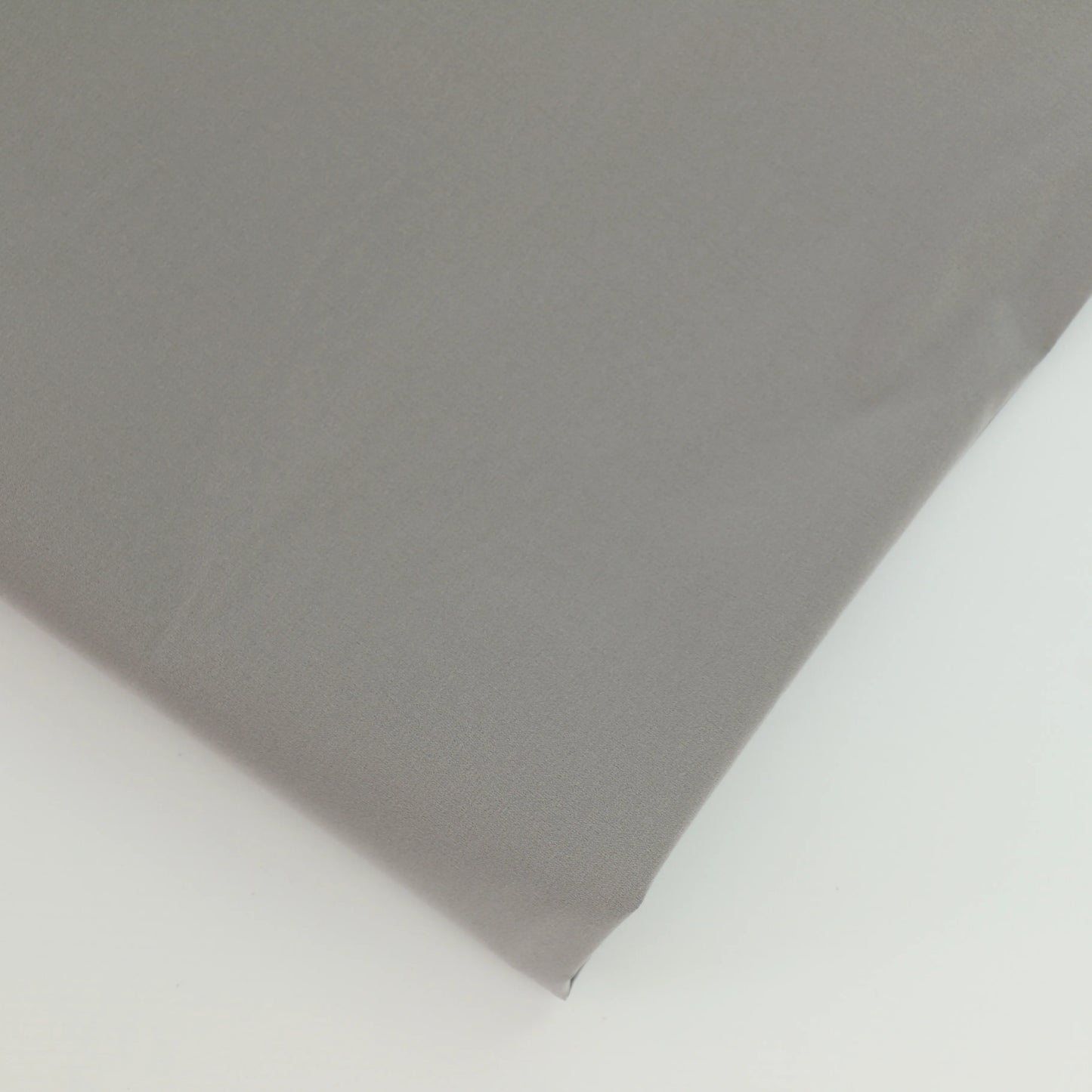 silver-grey-stretch-taffeta-fabric – close-up of colour, pattern and texture