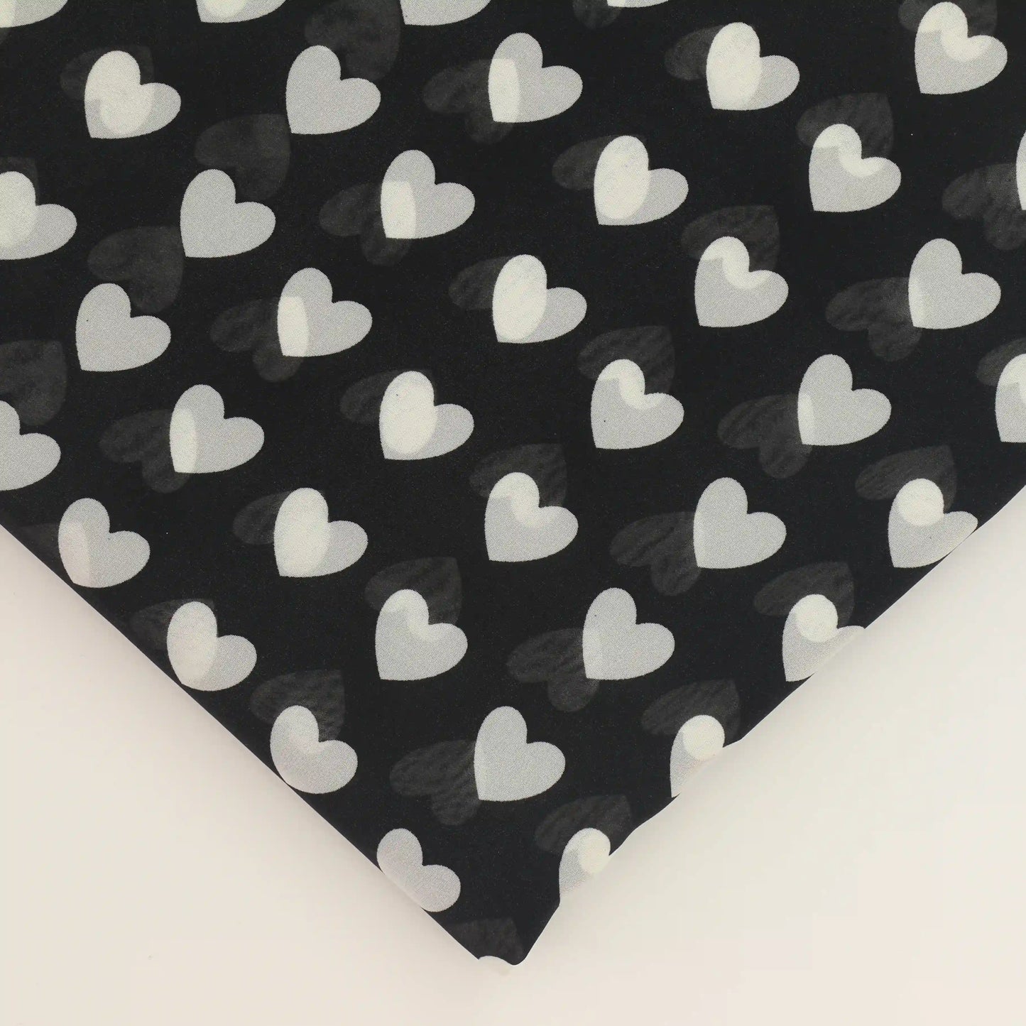 black-and-white-heart-print-chiffon-fabric – close-up of colour, pattern and texture