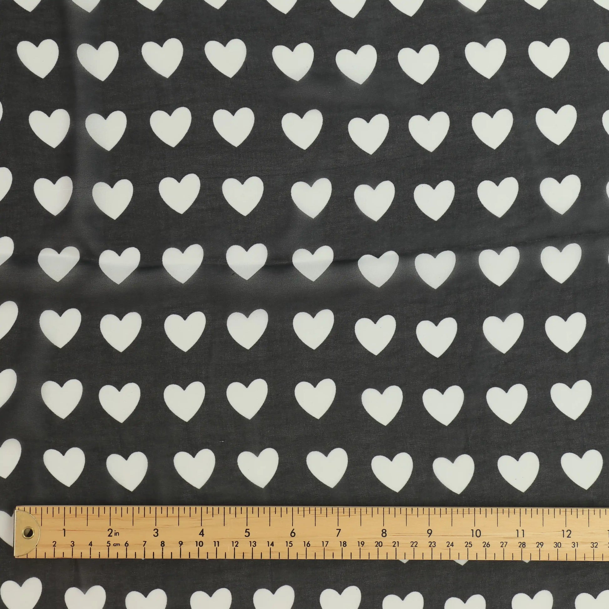 black-and-white-heart-print-chiffon-fabric – close-up showing weave and surface detail