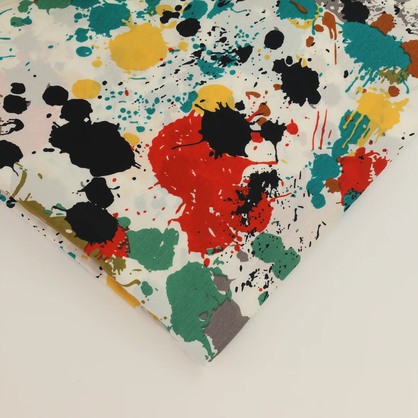 paint-splatter-polyester-peach-skin-fabric – close-up of colour, pattern and texture