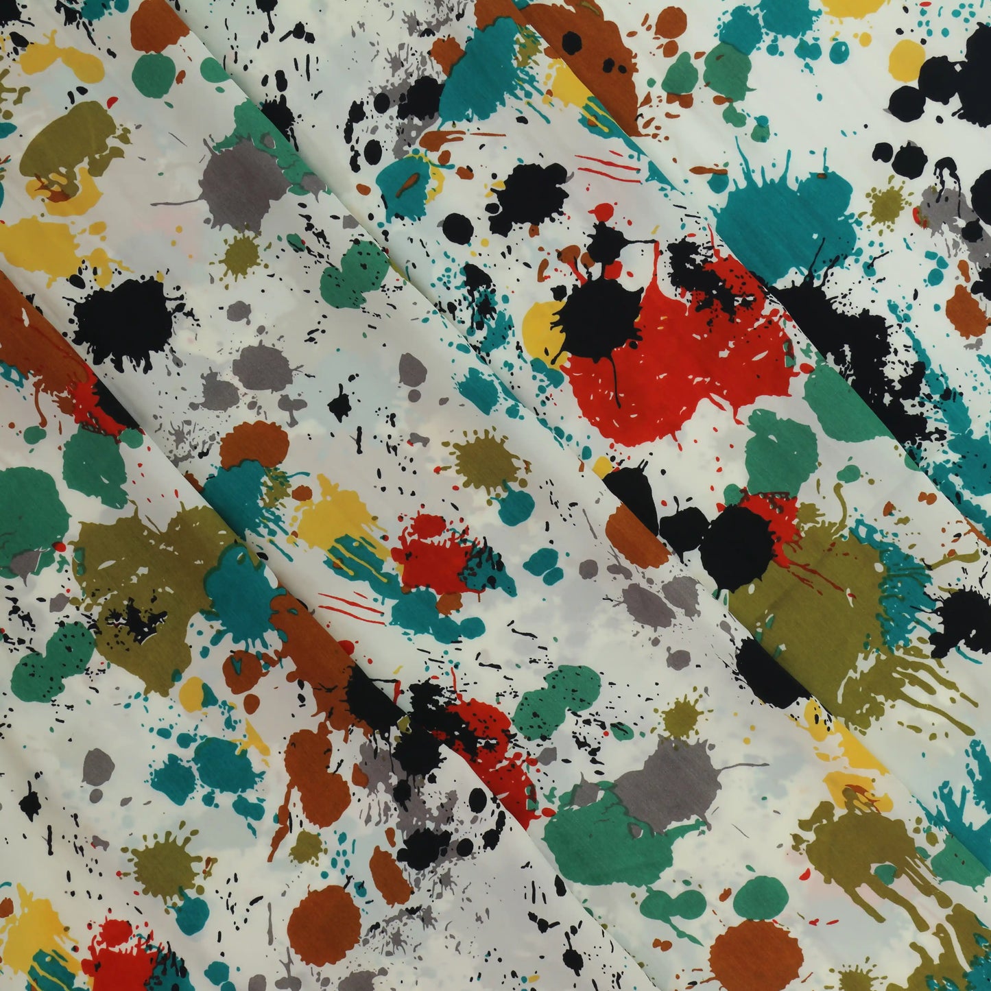 paint-splatter-polyester-peach-skin-fabric – close-up showing weave and surface detail